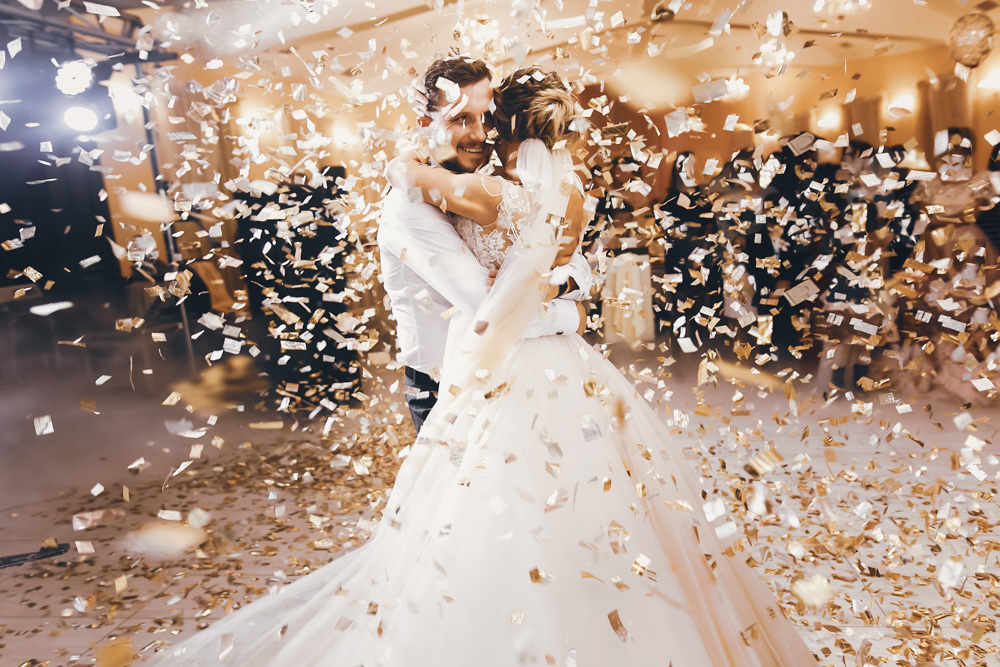 Dancing couple wedding confetti